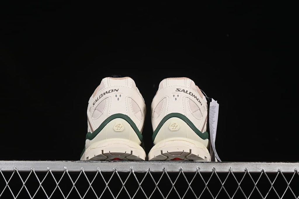 Rear view of the pair showing the heel details and outsole edges.