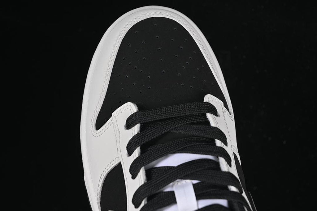 Top view of the perforated black toe box and laces