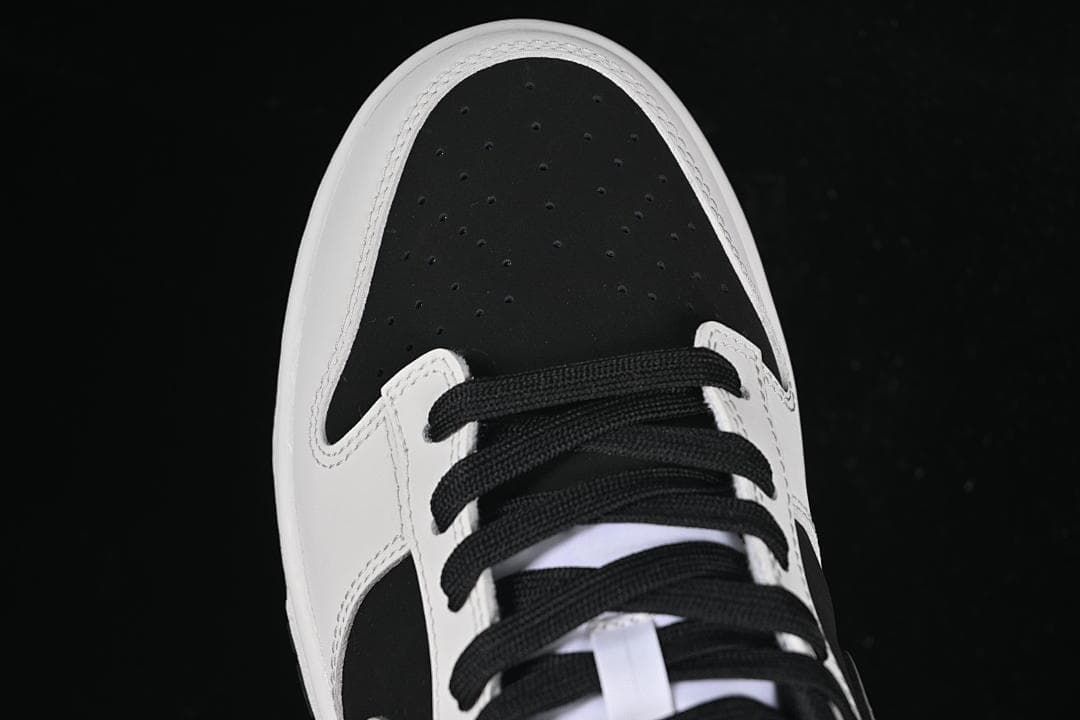 Top view of the perforated black toe box and laces