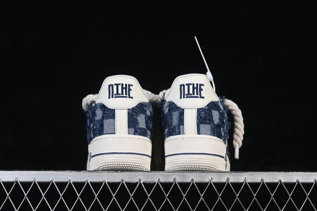 Rear view of the pair showing denim-style heel panels and off-white heel tabs