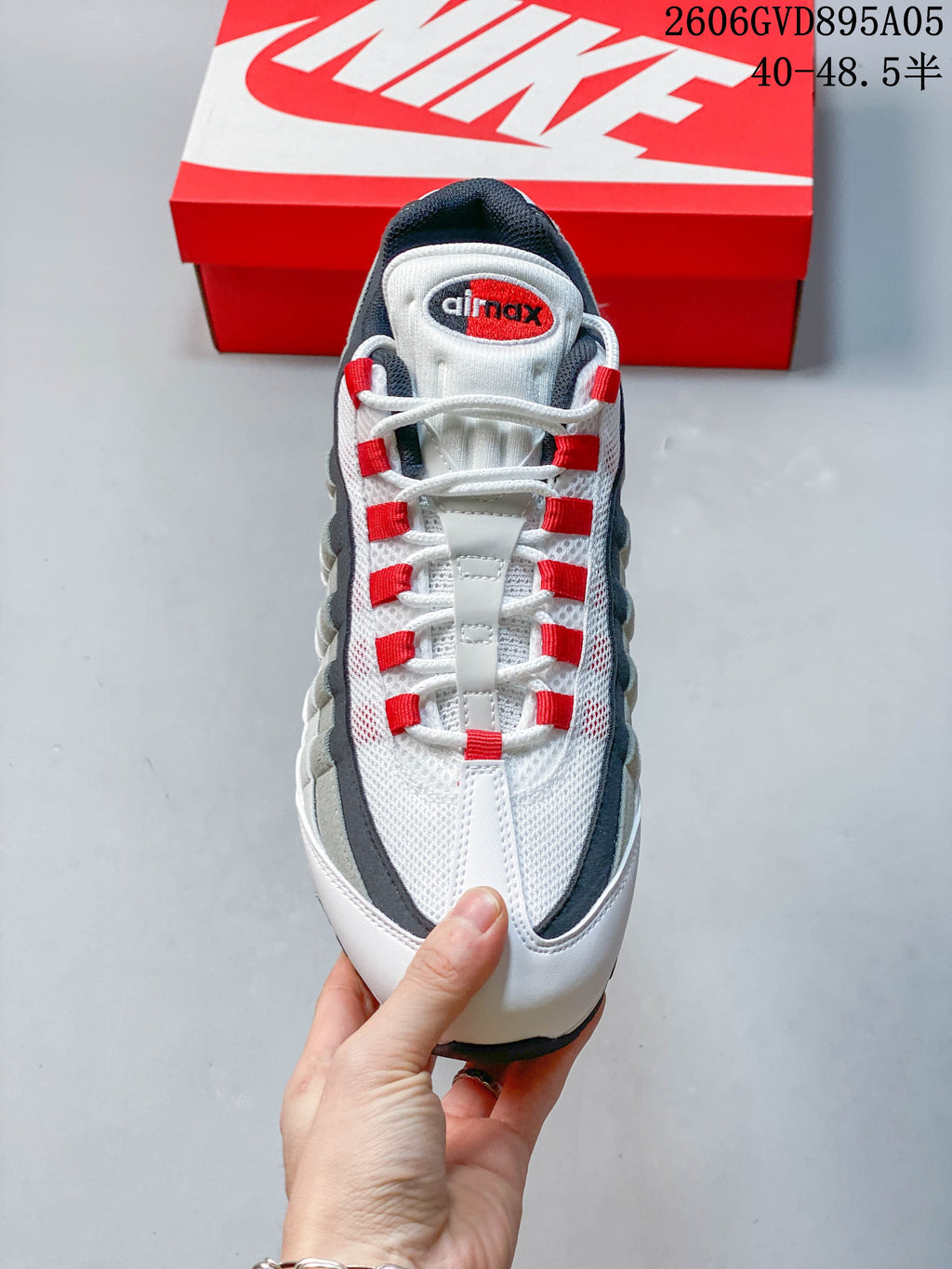 Front view showing the mesh upper, red lace loops, and Air Max tongue logo.