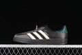 Side profile of the black adidas Gazelle Indoor with grey overlays, off-white stripes, and teal-green heel detail