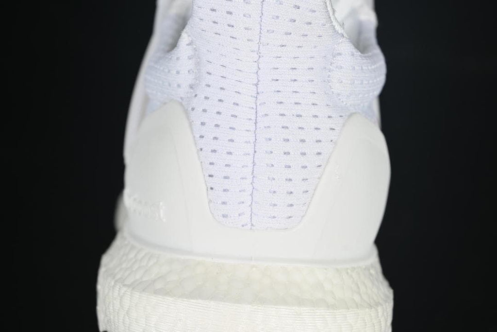 Rear view highlighting the knit heel and heel counter.
