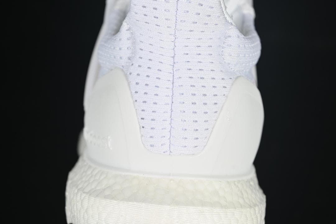Rear view highlighting the knit heel and heel counter.
