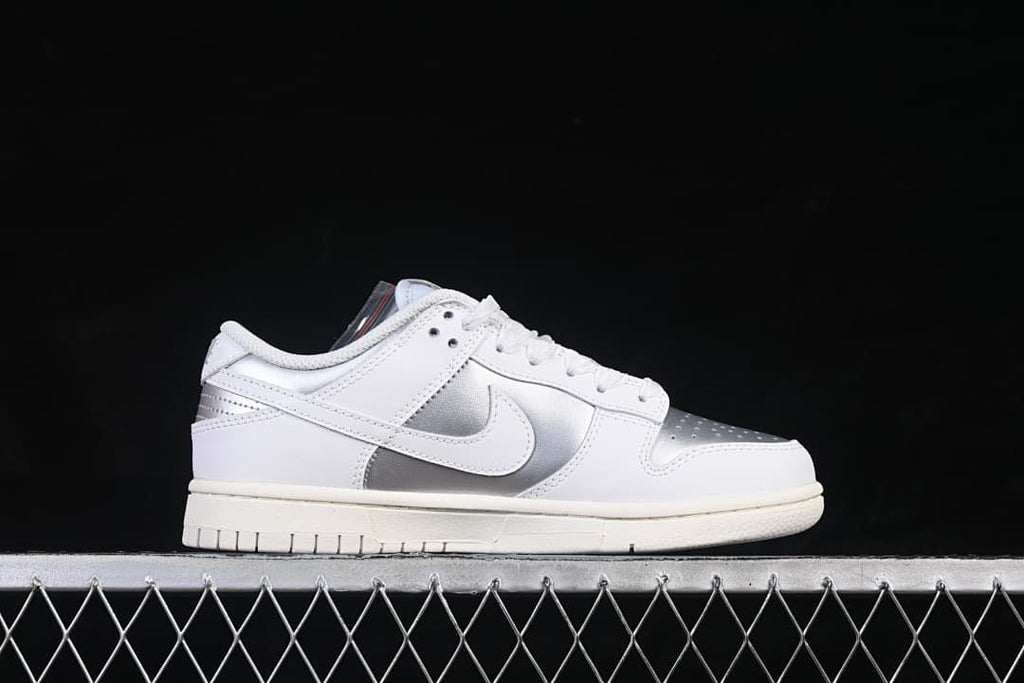 Side profile of the white and silver low-top sneaker