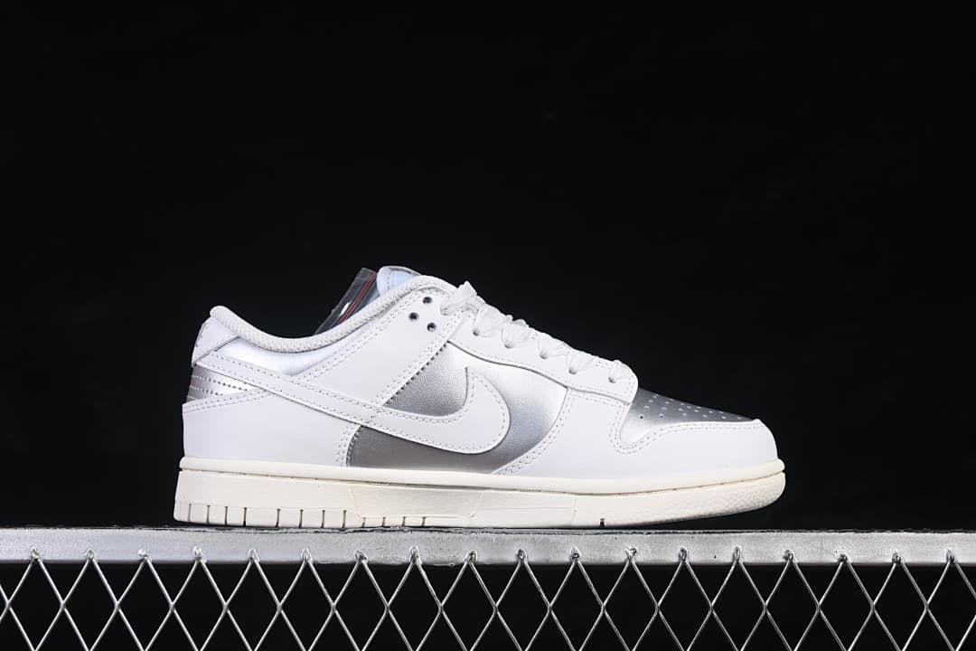 Side profile of the white and silver low-top sneaker