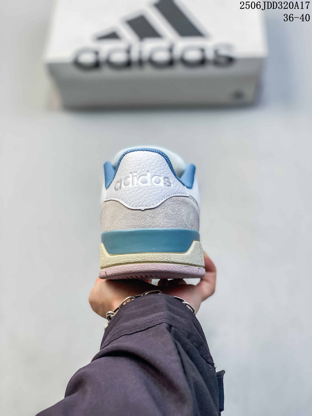 Rear view of the sneaker with a blue heel accent and layered sole.