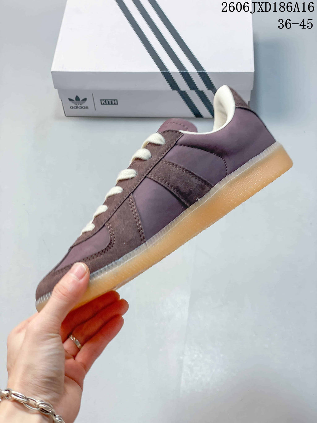 Side profile showing the three stripes and low-top silhouette