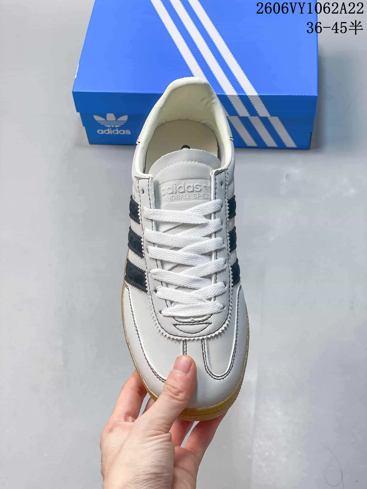 Top view showing the laces, stitched panels, and navy side stripes