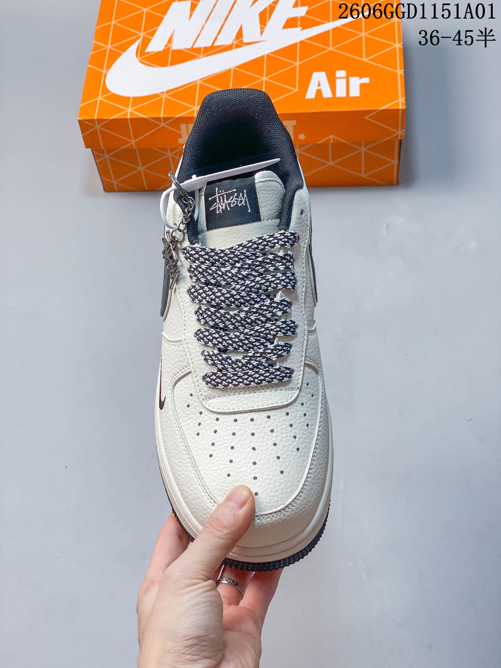 Top view showing perforated toe, patterned laces, and branded tongue