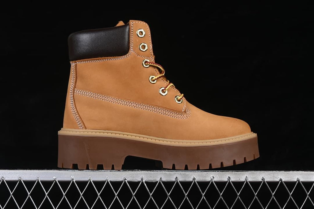 Side profile of the wheat-colored boot with a thick platform sole