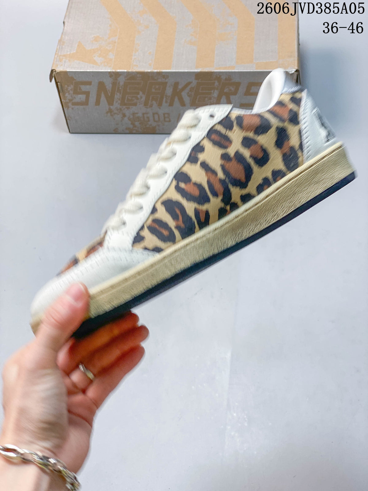 Side profile of a leopard-print low-top sneaker with a cream star detail.