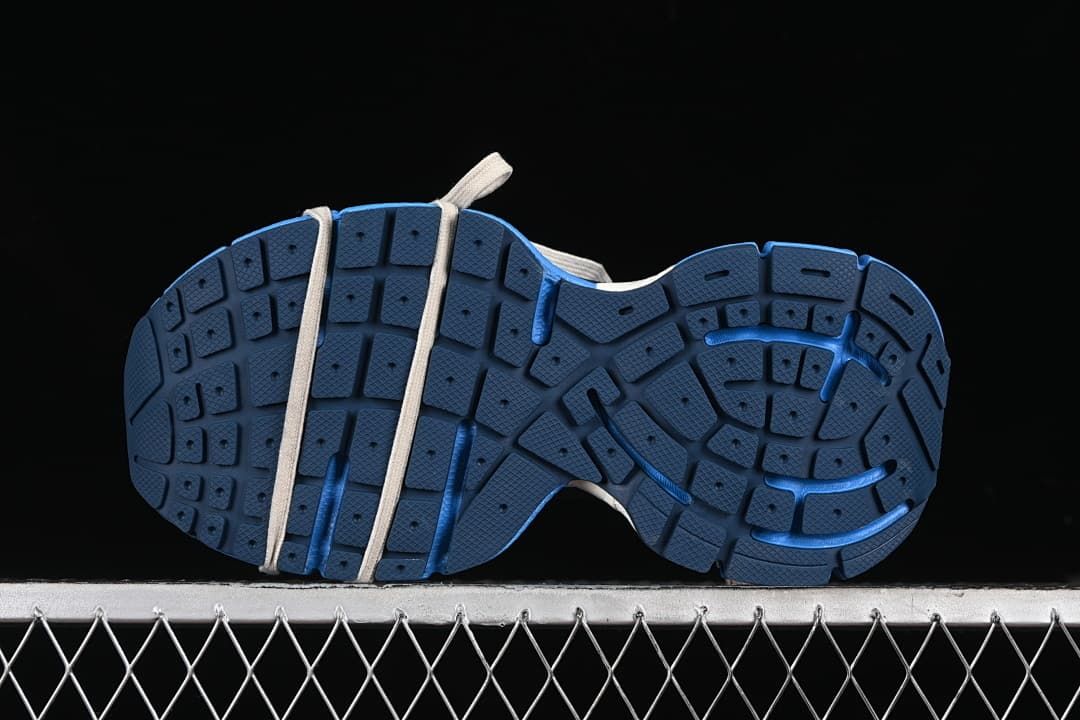 Underside view showing the segmented blue outsole tread