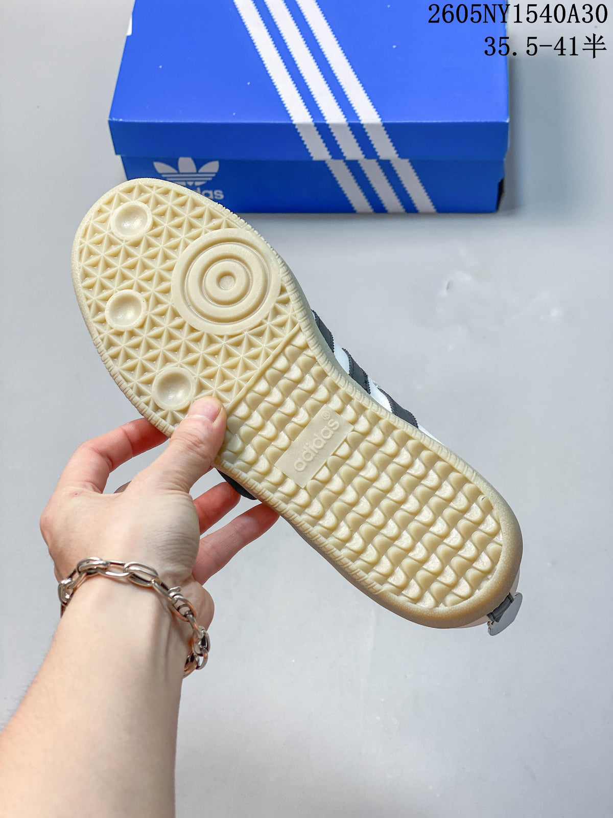Textured gum-tone outsole of a white Adidas Samba Jane sneaker