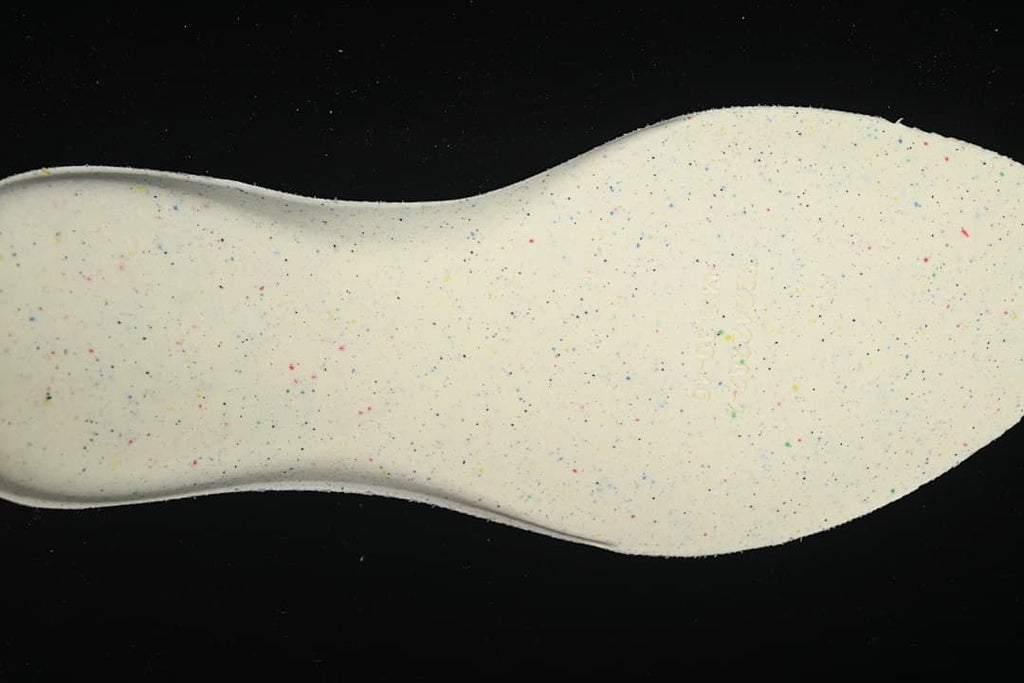 Close-up of the light-colored, speckled underside of the insole