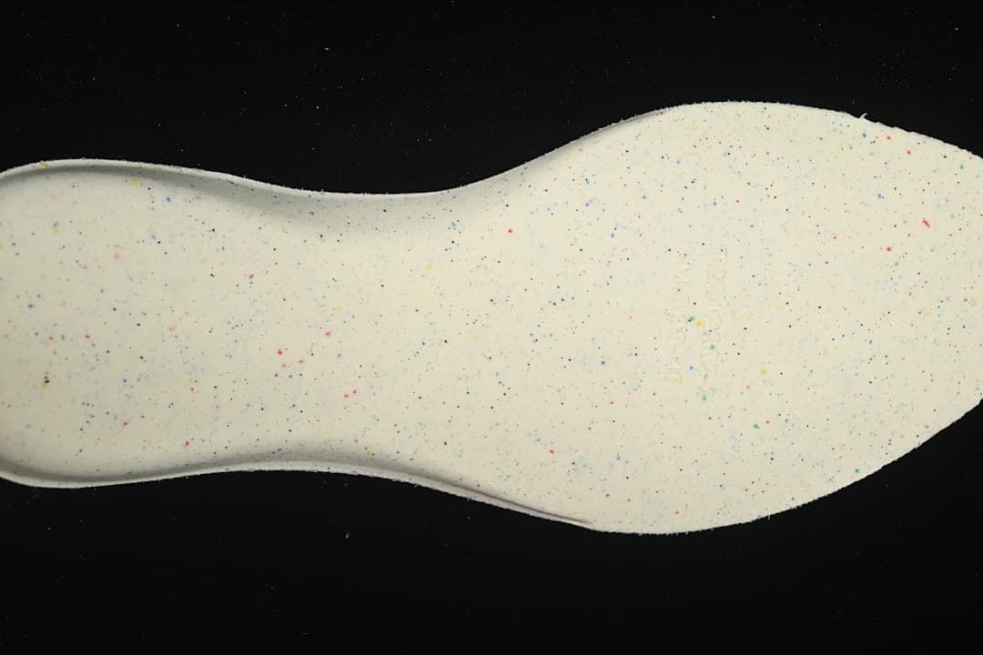 Close-up of the light-colored, speckled underside of the insole