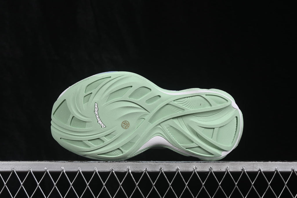 Outsole view showing the textured lime-green tread and sculpted pattern.