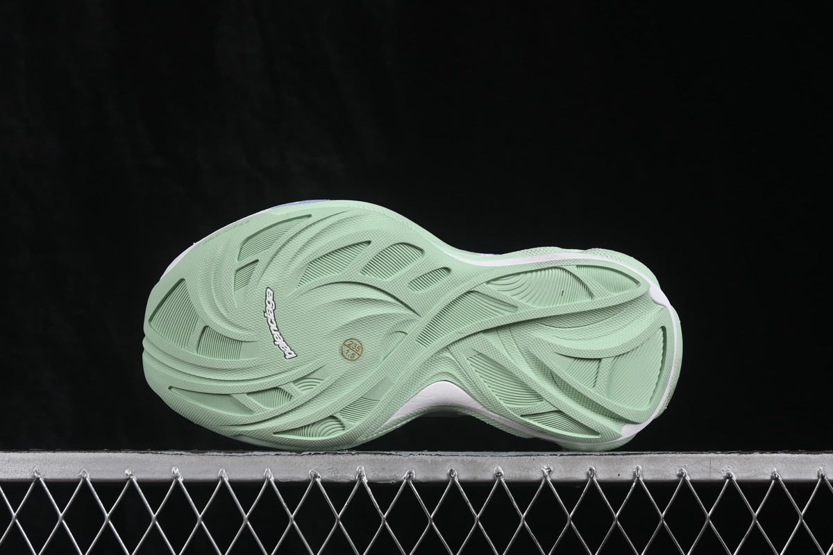 Outsole view showing the textured lime-green tread and sculpted pattern.