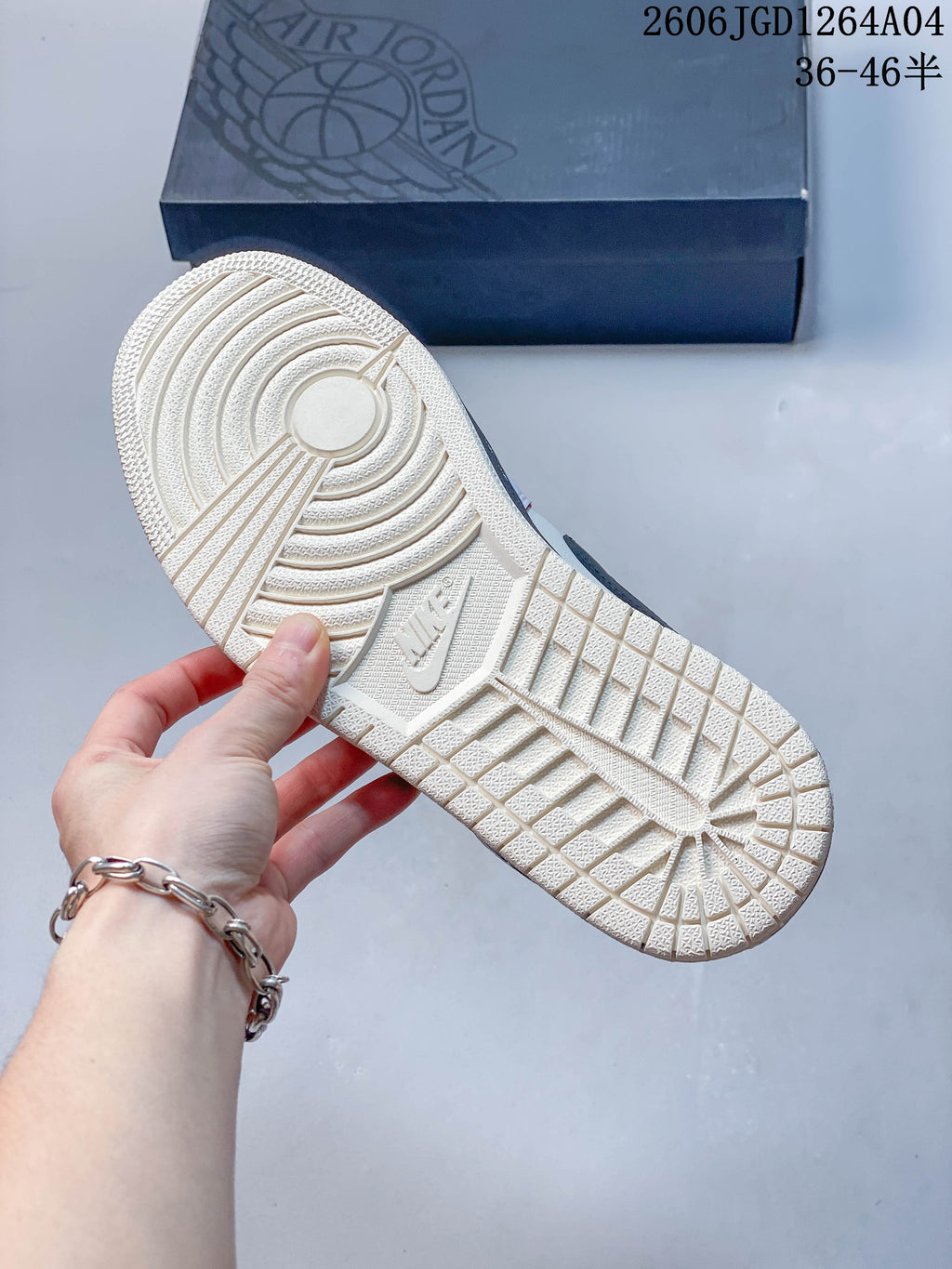 Outsole view of the Air Jordan 1 Low sneaker with a light-colored tread