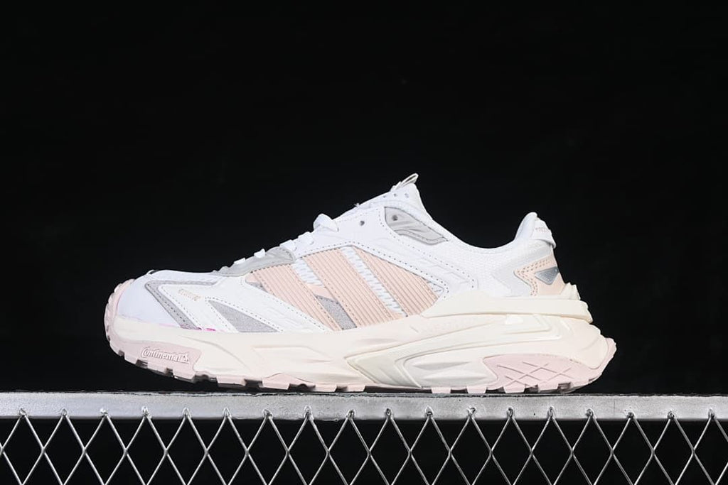 Side profile of the white and pink XLG Storm Edge sneaker