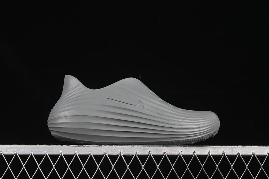 Side profile of the grey sculpted clog sandal