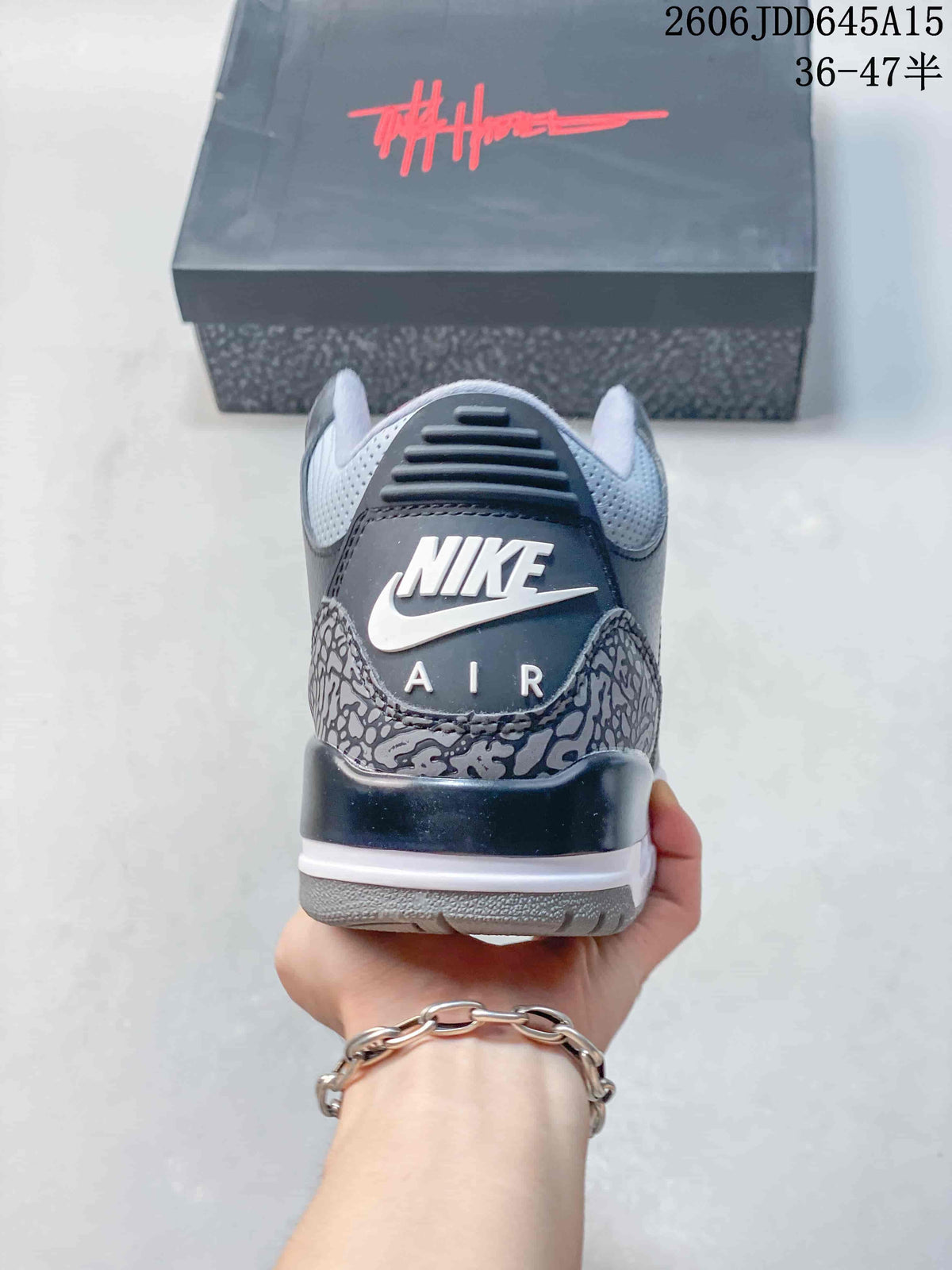 Heel view of a grey sneaker with elephant-print overlays and Nike Air branding.