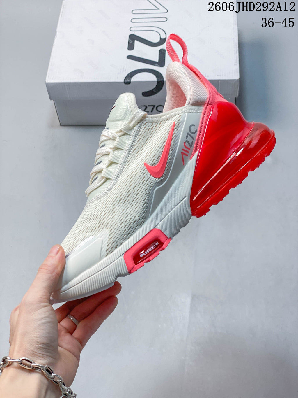 Side view of a white and red Nike Air Max 270 sneaker