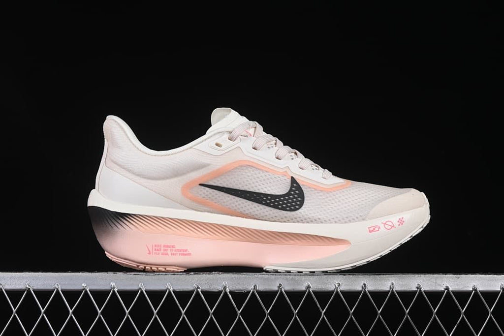 Side profile highlighting the white upper, pink accents, and sculpted sole
