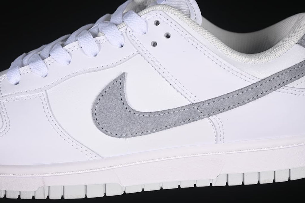 Close-up of the grey Swoosh on the white side panel
