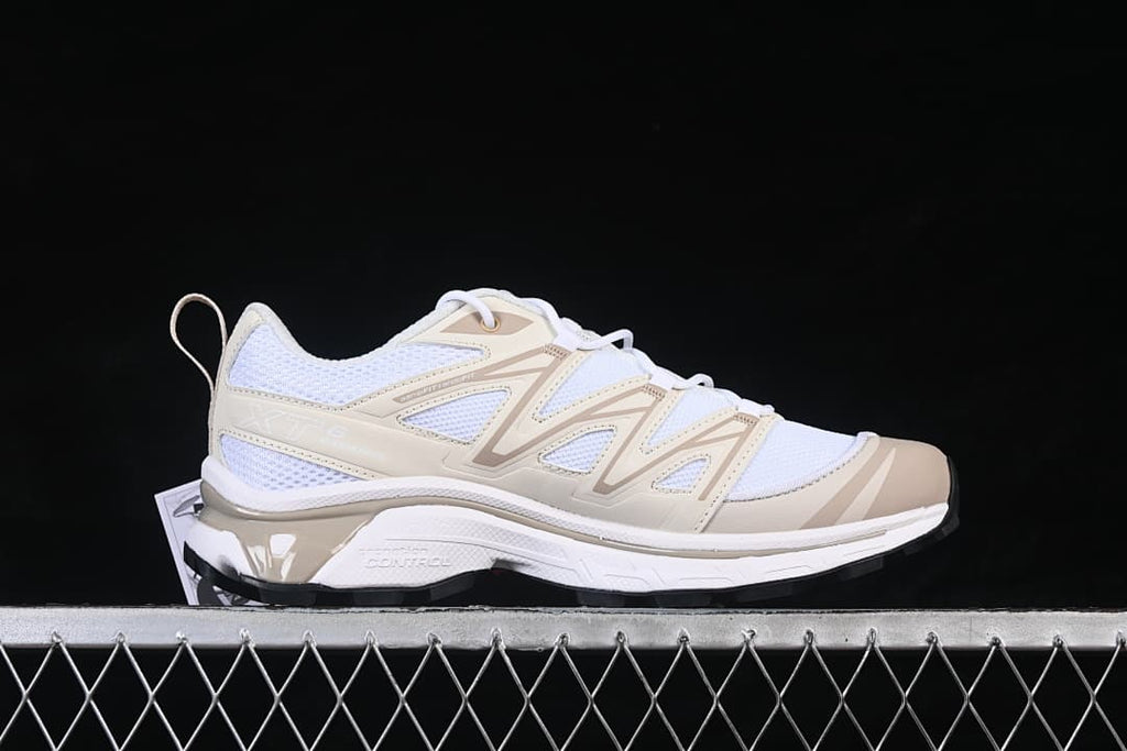Side view of a white and tan Salomon XT-6 Expanse sneaker.