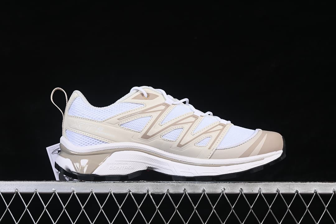Side view of a white and tan Salomon XT-6 Expanse sneaker.