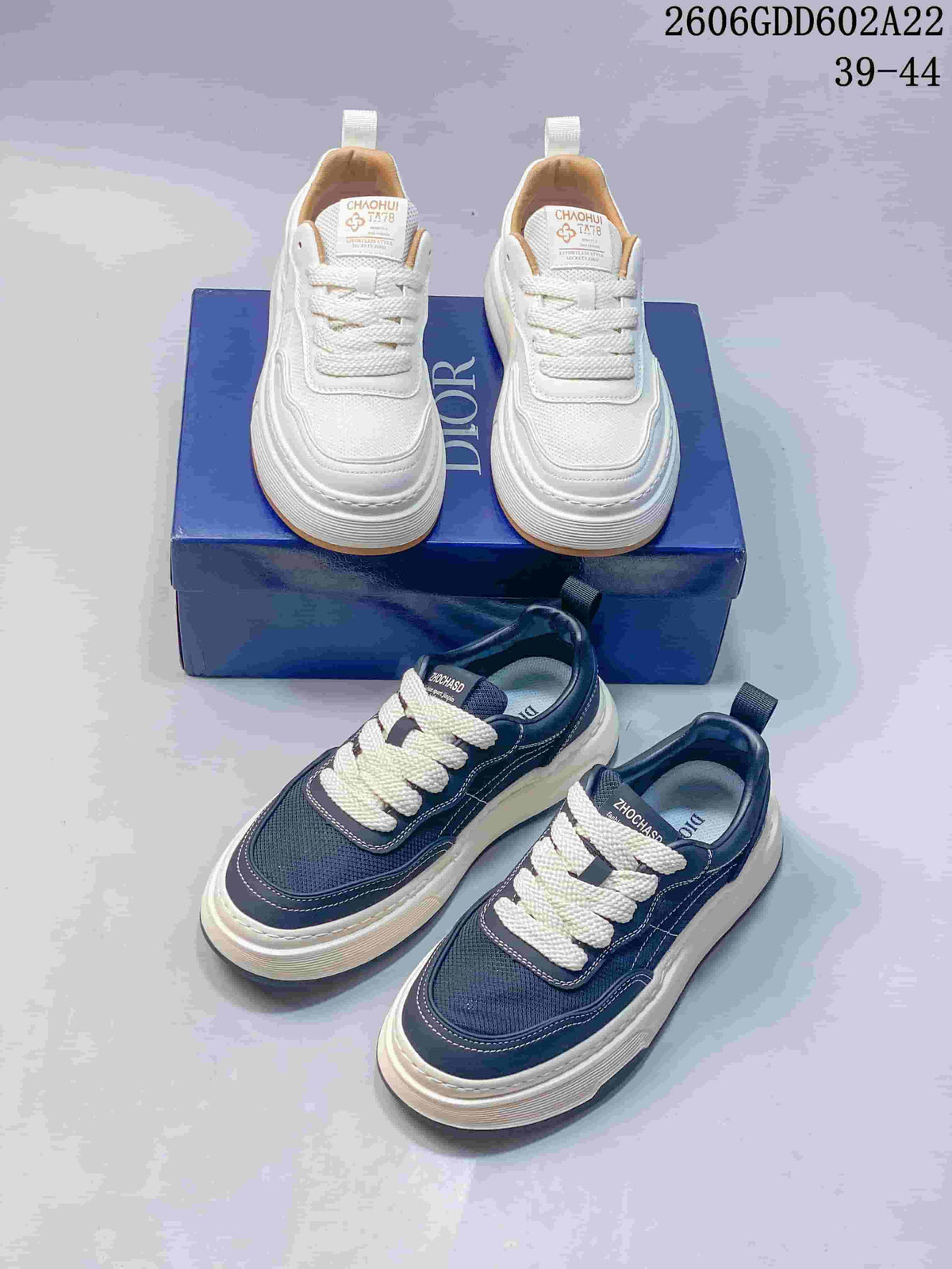White and navy low-top sneakers shown together from above.