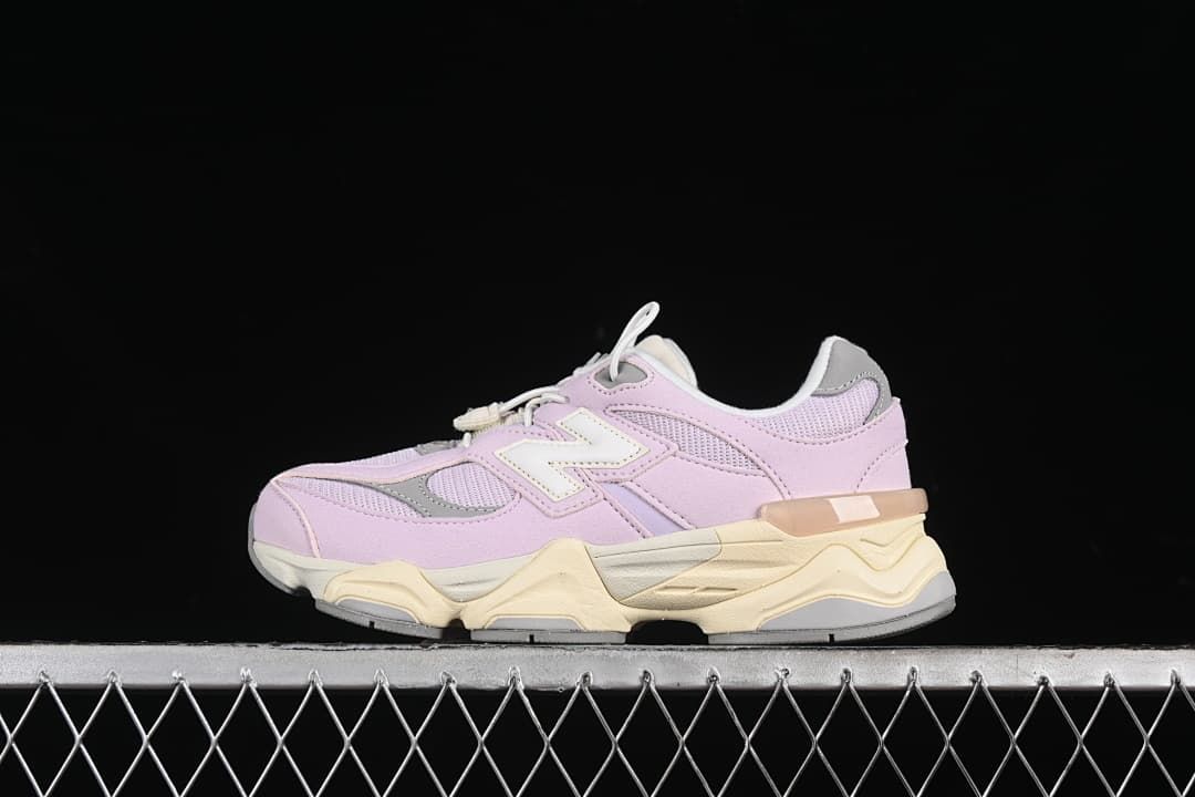 Side view of lavender, grey, and cream New Balance kids sneakers