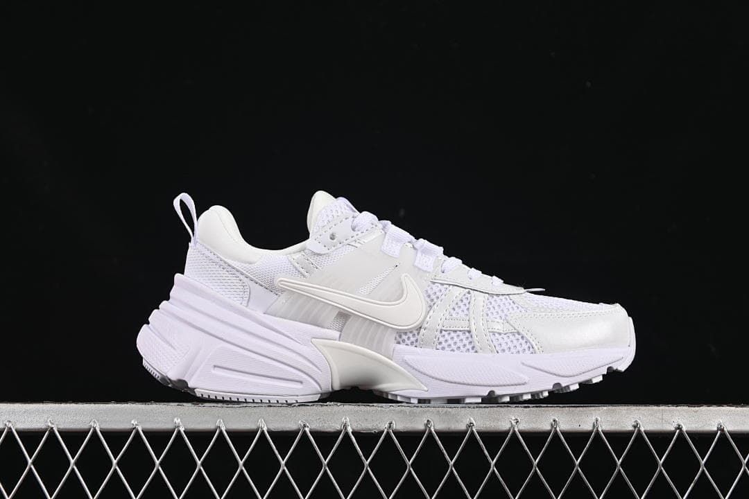 Side profile of one white Nike V2K Run sneaker