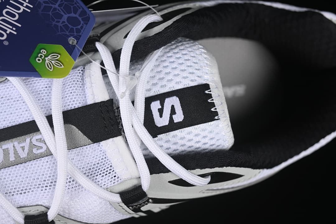 Close-up of the mesh tongue, laces, and Salomon branding.