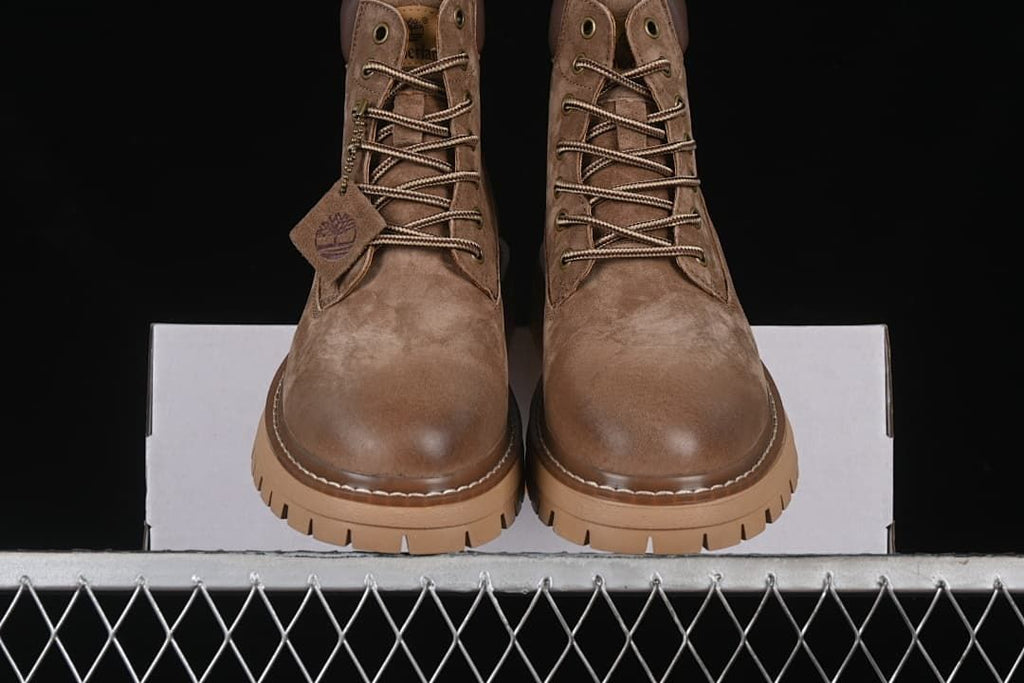 Front view of the pair of boots with contrasting laces