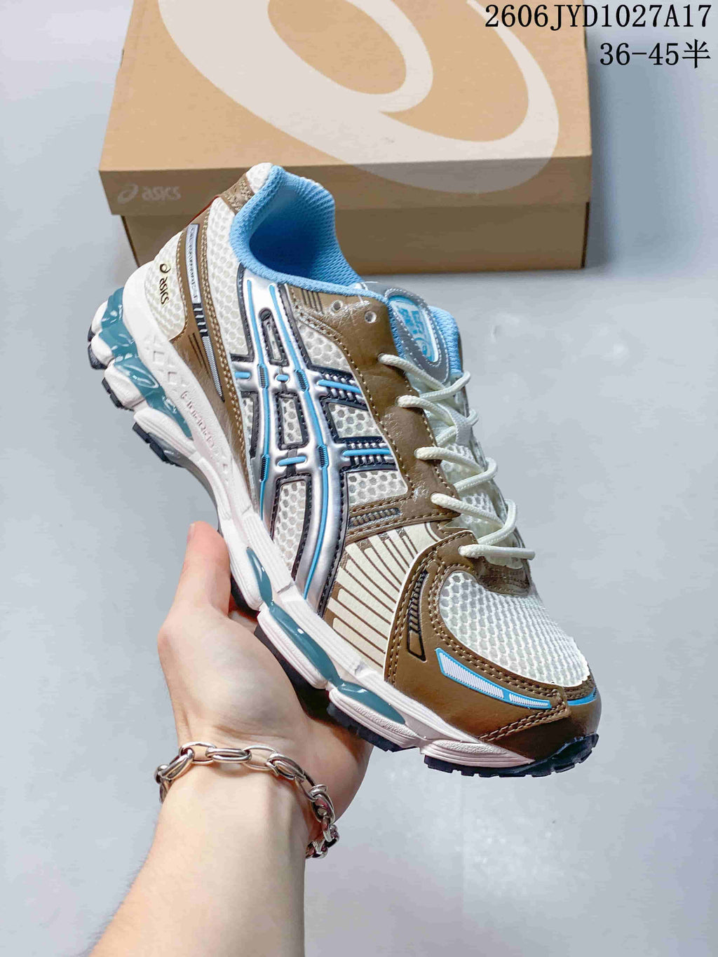 Dark ASICS GEL-KAYANO 12.1 sneaker with iridescent details