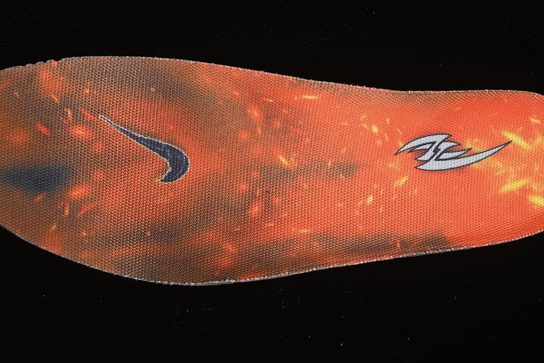 Orange insole with graphic details.