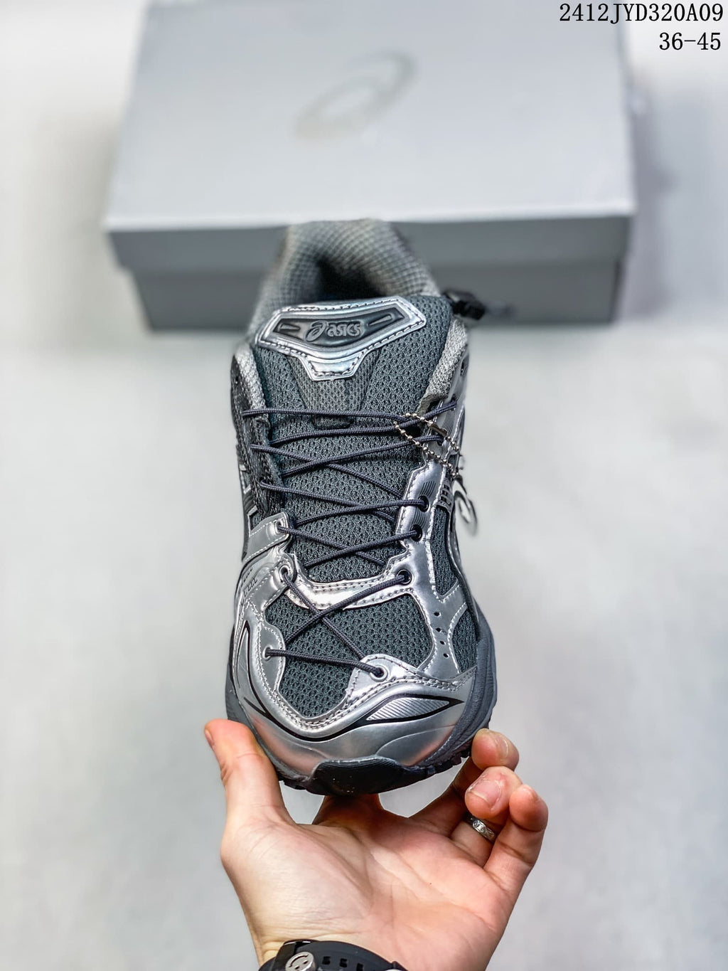 Front view showing the mesh-look tongue, laces, and metallic-look overlays of a gray sneaker; image overlay reads 2412JYD320A09 and 36–45.