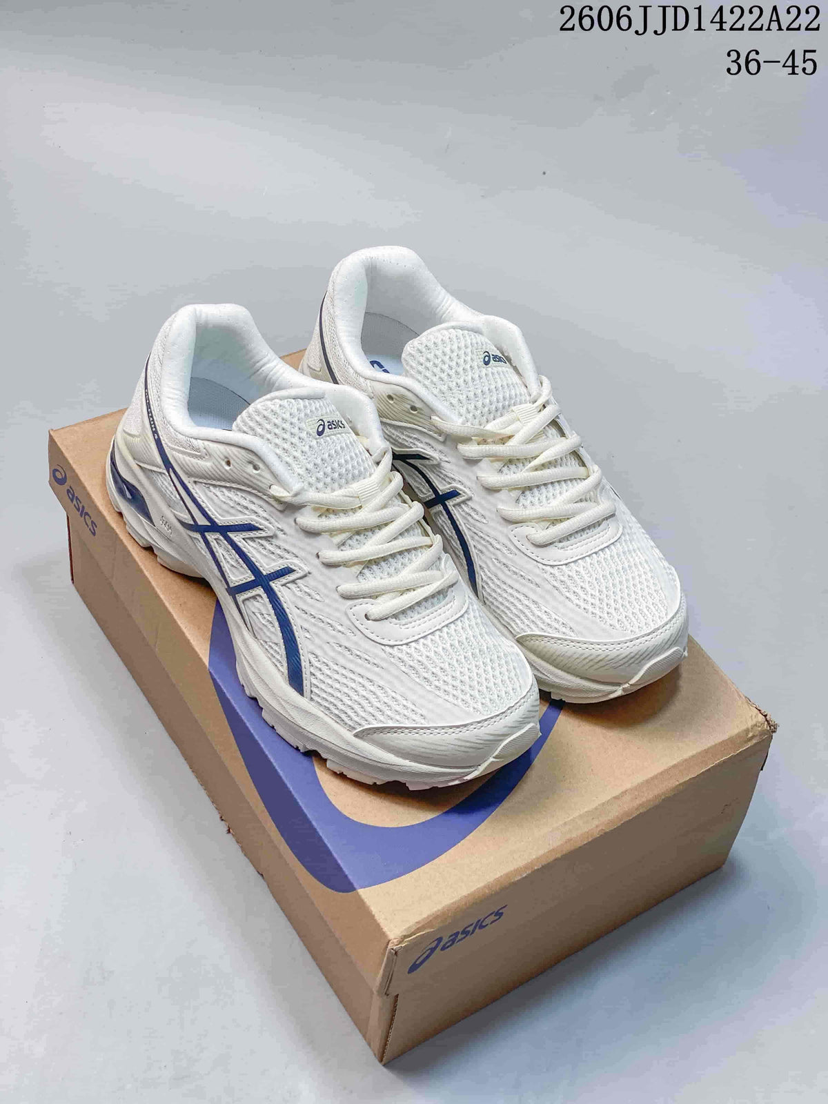 White and blue ASICS GEL-FLUX shoes shown on a branded shoebox