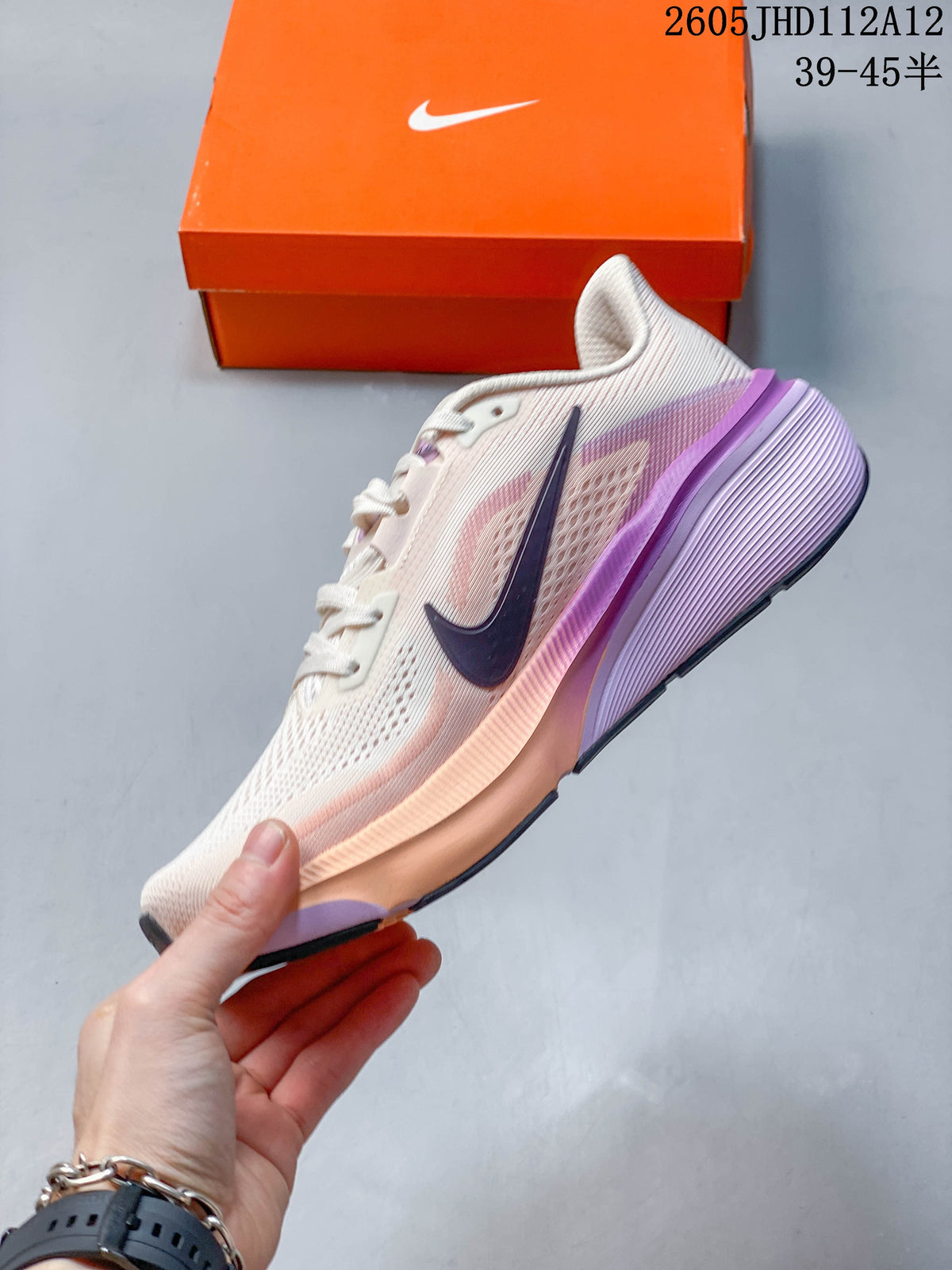 Side profile showing the cream mesh-style upper, dark Swoosh, and peach and purple accents.