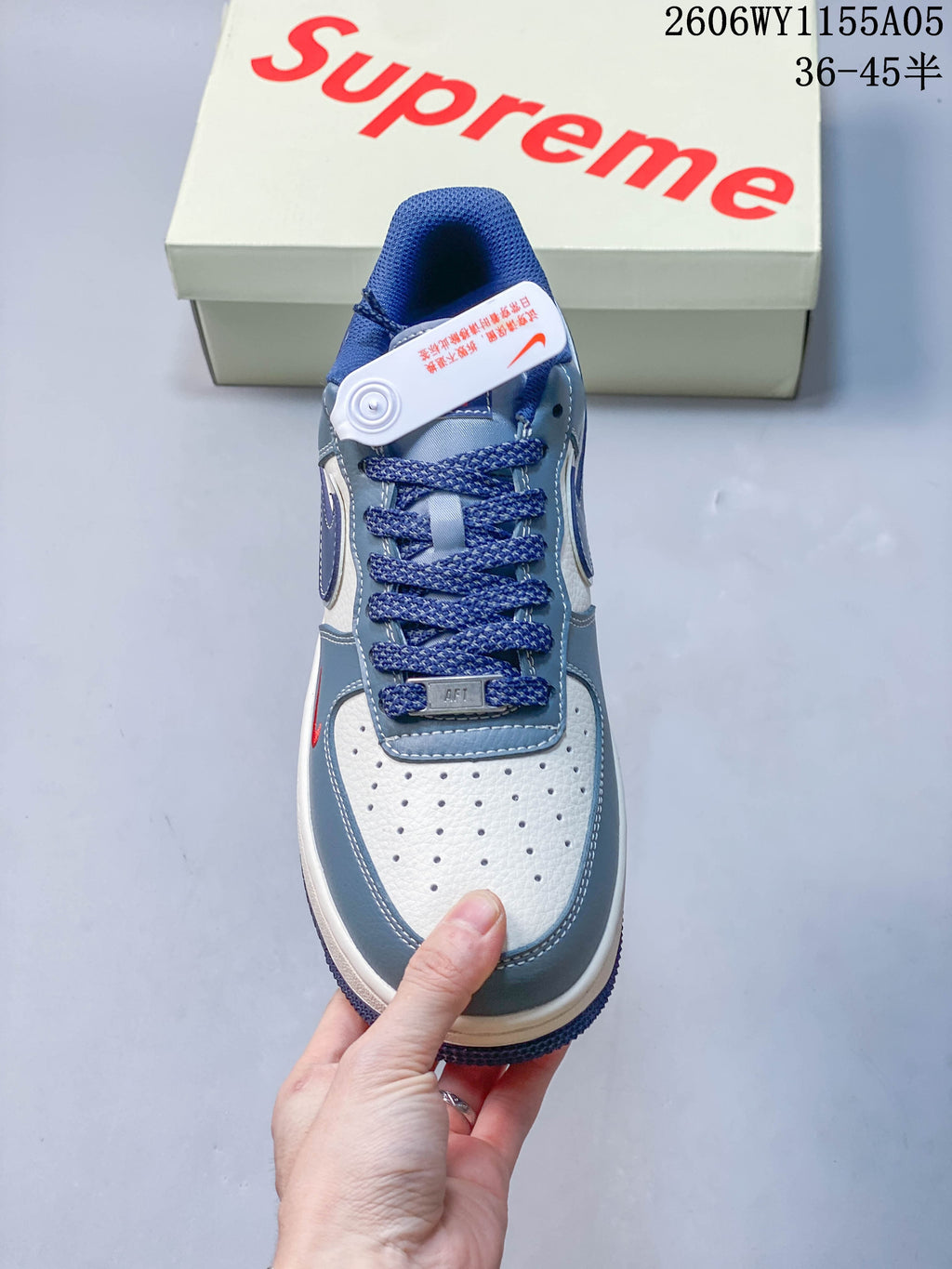 Top view showing perforated toe, blue laces, and tongue