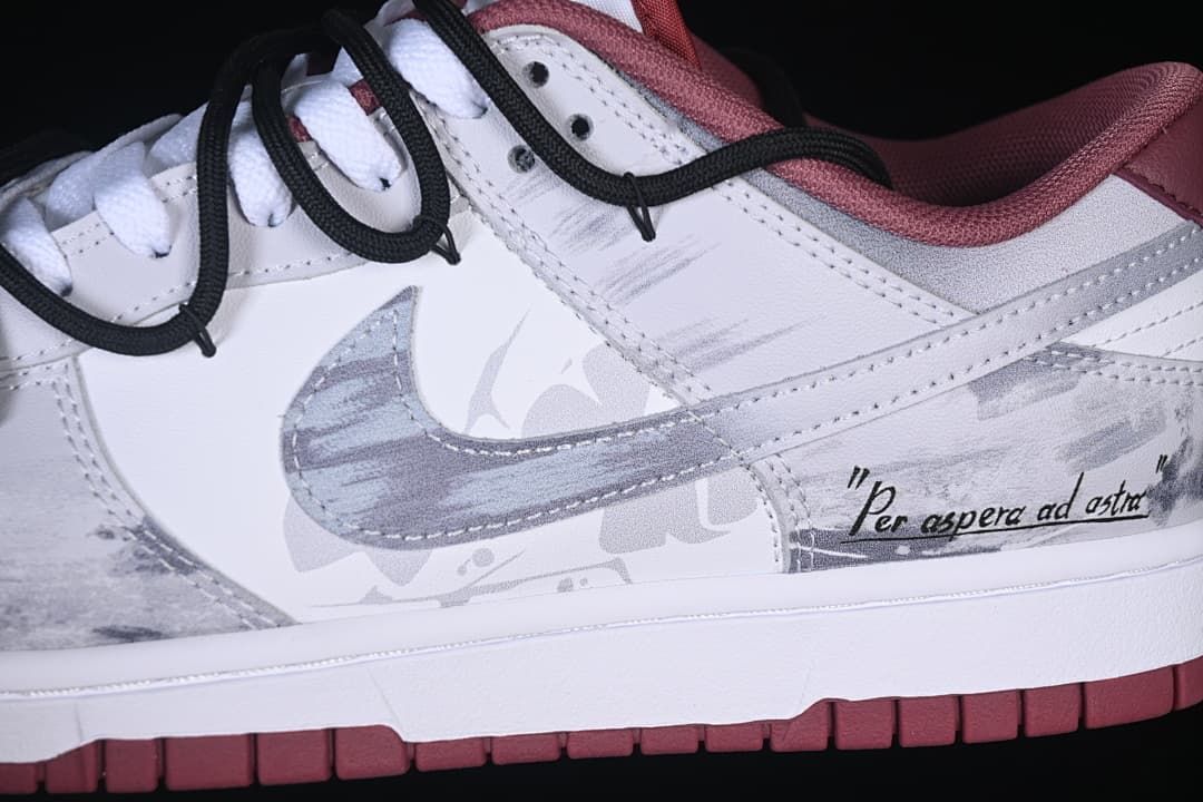 Close-up of gray Swoosh, patterned overlays, and black cord-style straps
