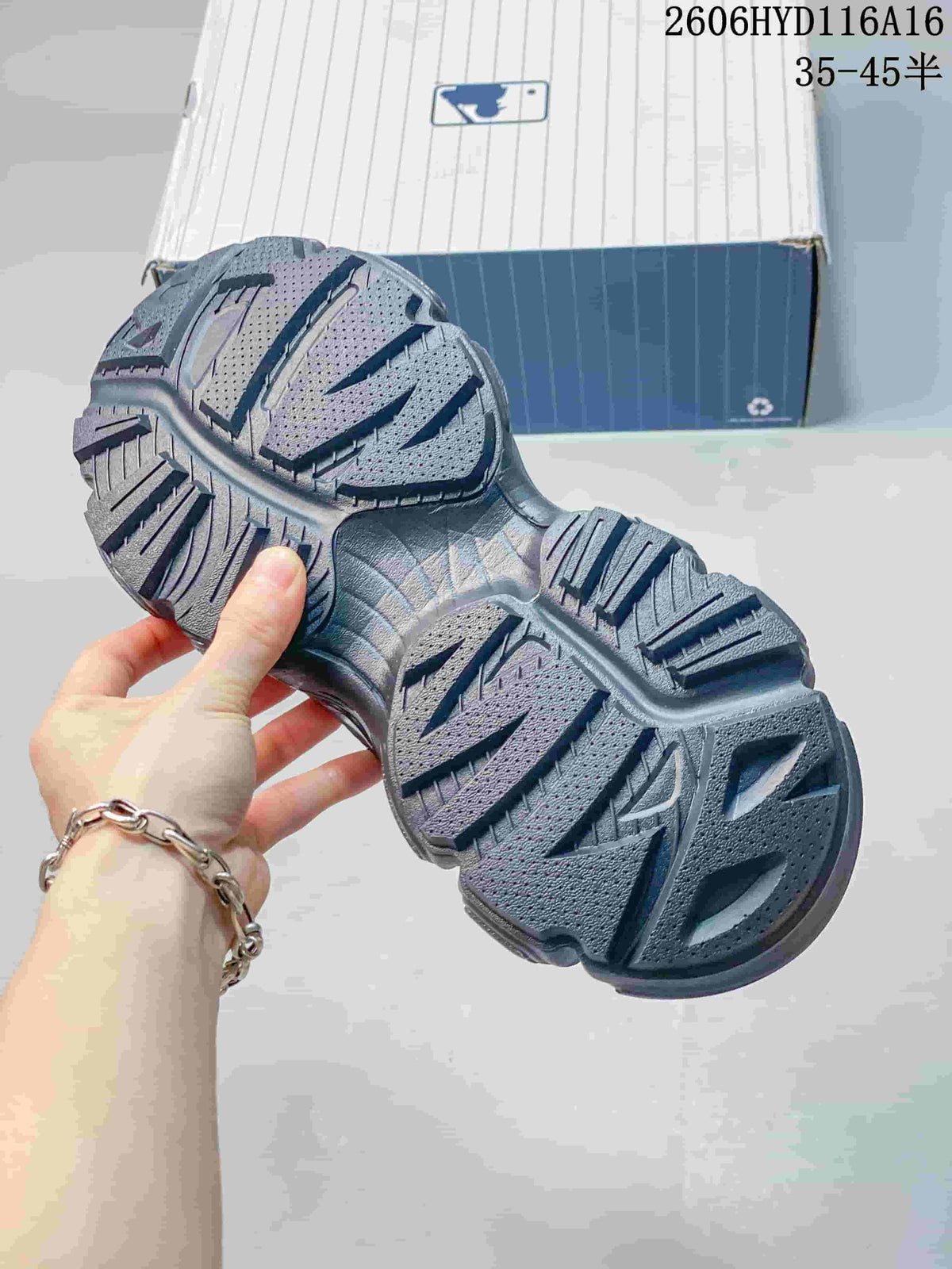Close-up of the patterned tread on a charcoal chunky sneaker