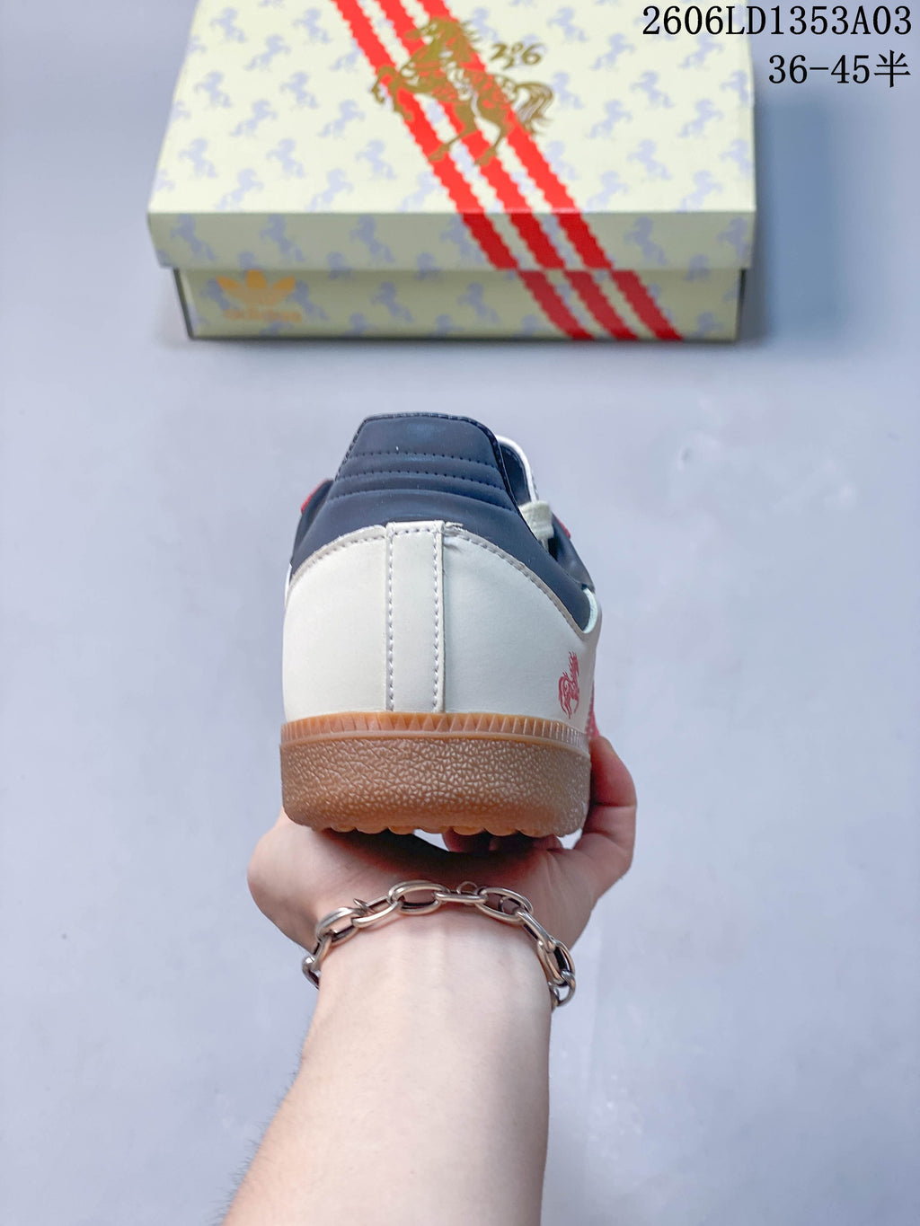 Rear view of the sneaker showing its navy heel collar and gum-colored outsole