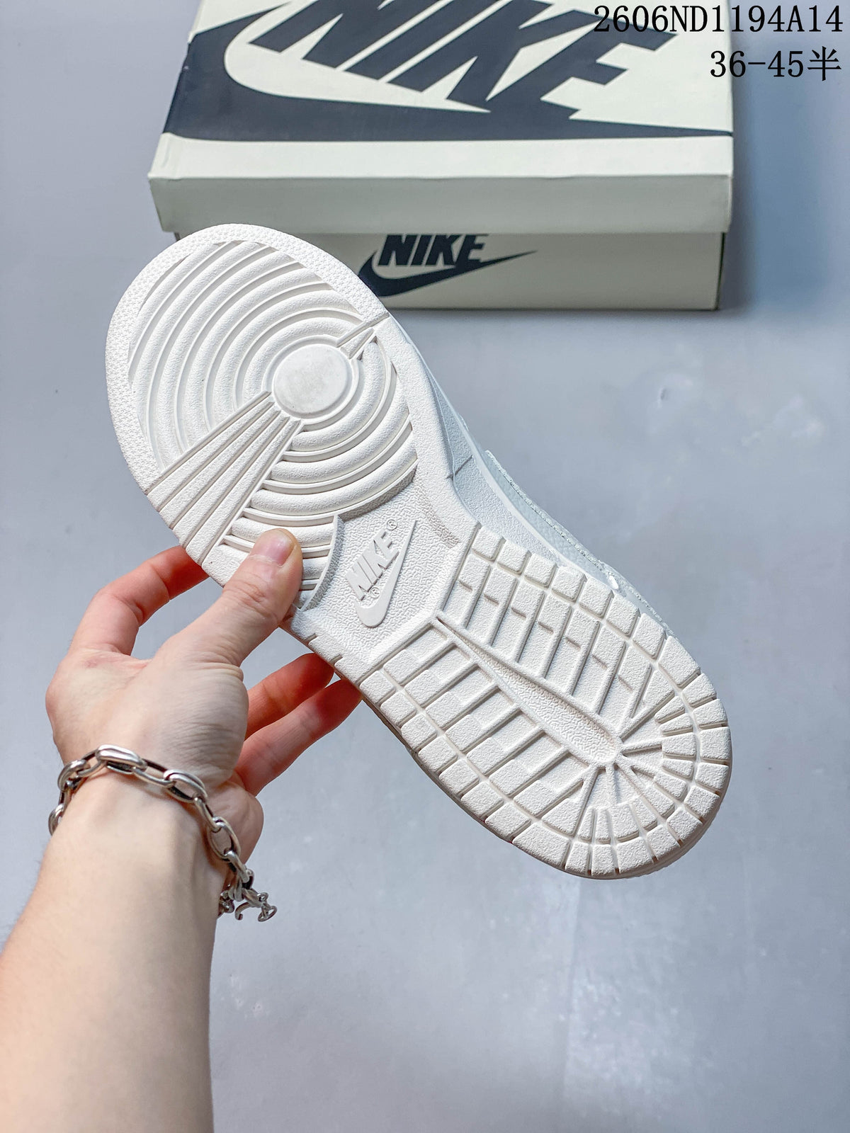Close-up of the white patterned outsole on the sneaker