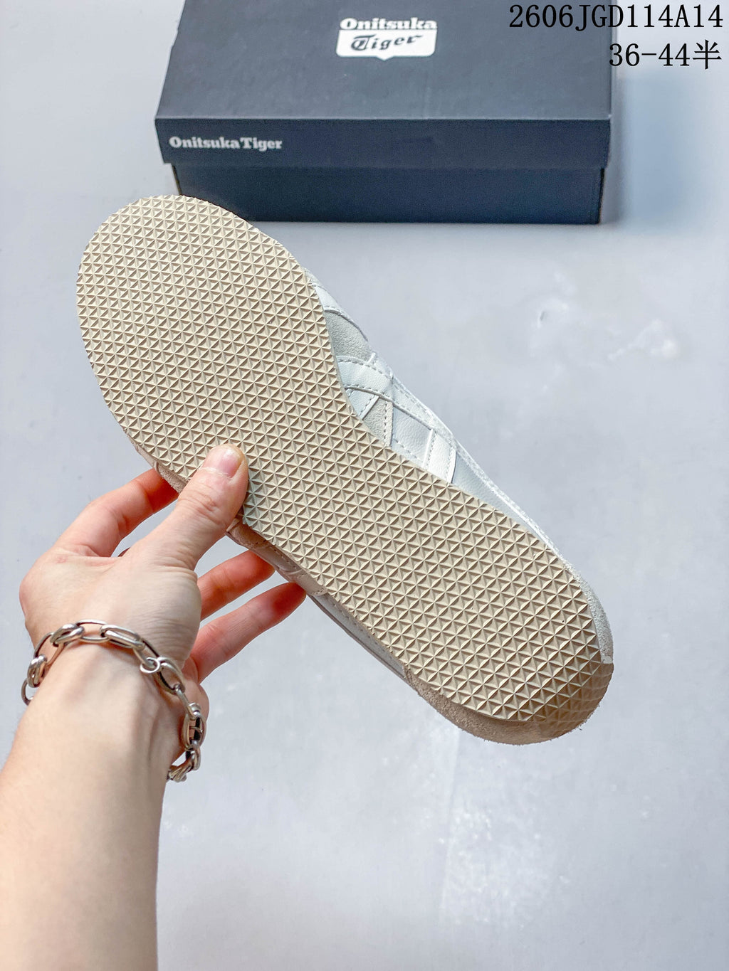 Close-up of the textured outsole on an Onitsuka Tiger Runspark sneaker