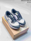 Pair of gray and navy On Cloudmonster 3 shoes with yellow outsole accents, shown on a box