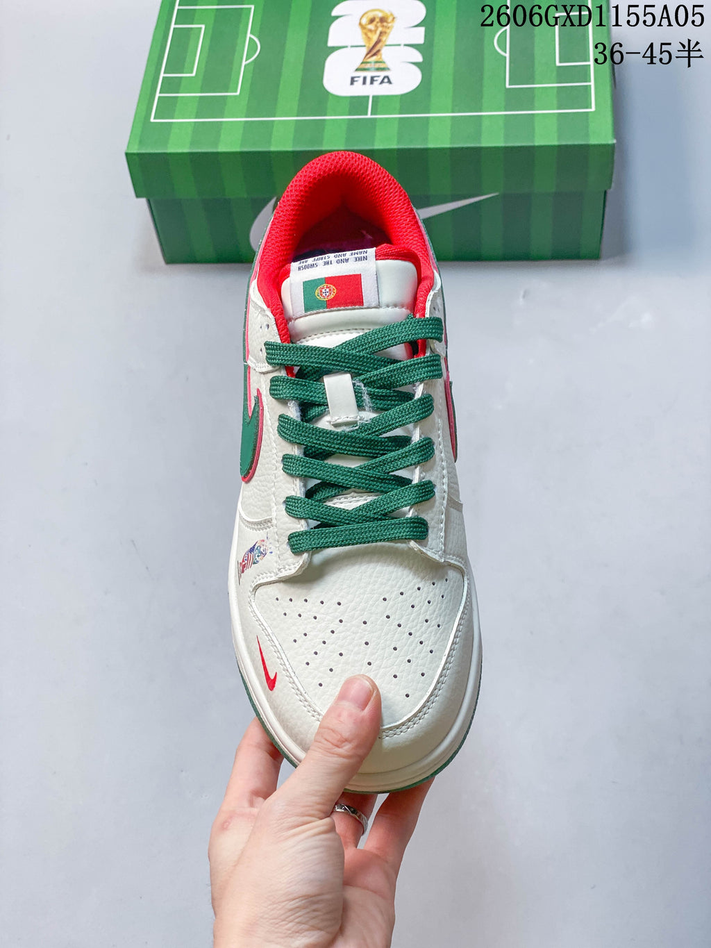 Top view highlighting green laces, a Portugal flag graphic on the tongue, and a perforated toe box
