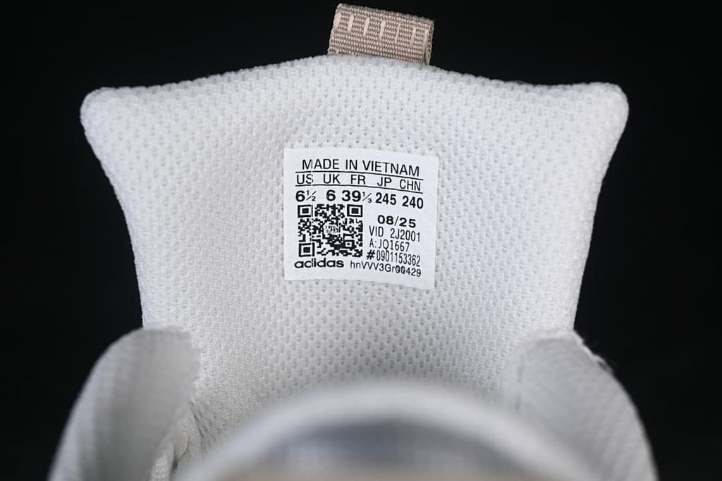Tongue label showing the photographed sample's size conversions and style code JQ1667.